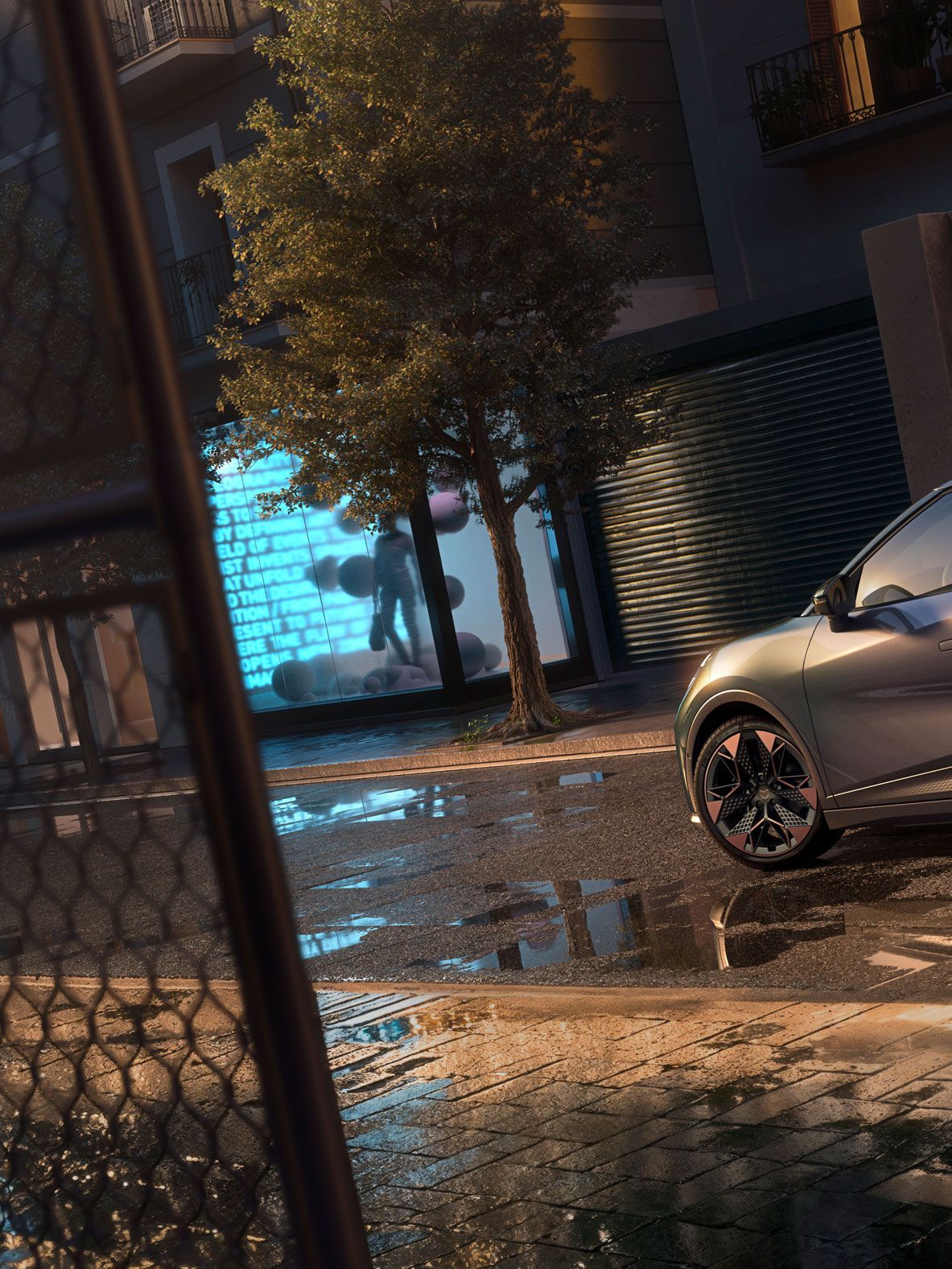 Nahaufnahme der Heckansicht des CUPRA Raval VZ in Plasma mit 19-Zoll-Felgen, geparkt auf einer städtischen Straße bei Nacht.